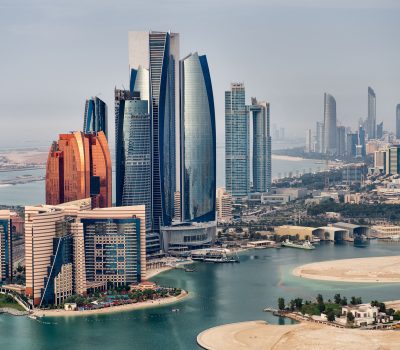 Helicopter point of view of Abu Dhabi skyline with surrounding area.